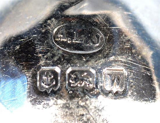 A George V Arts & Crafts silver three piece condiment set,